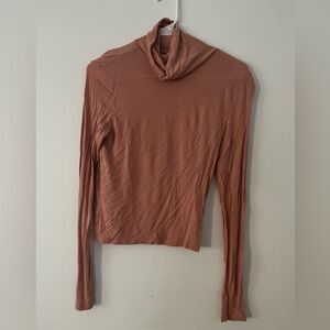 Pink long sleeve turtleneck top